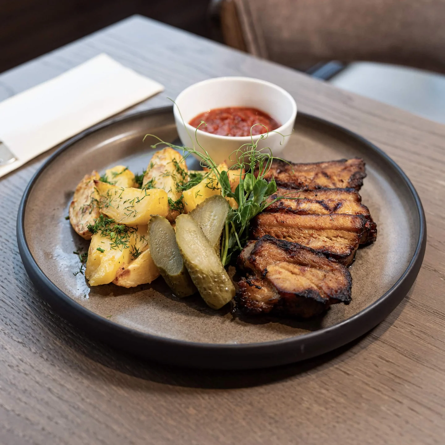 BBQ Pork Ribs with Roasted Potatoes and Spicy Sauce