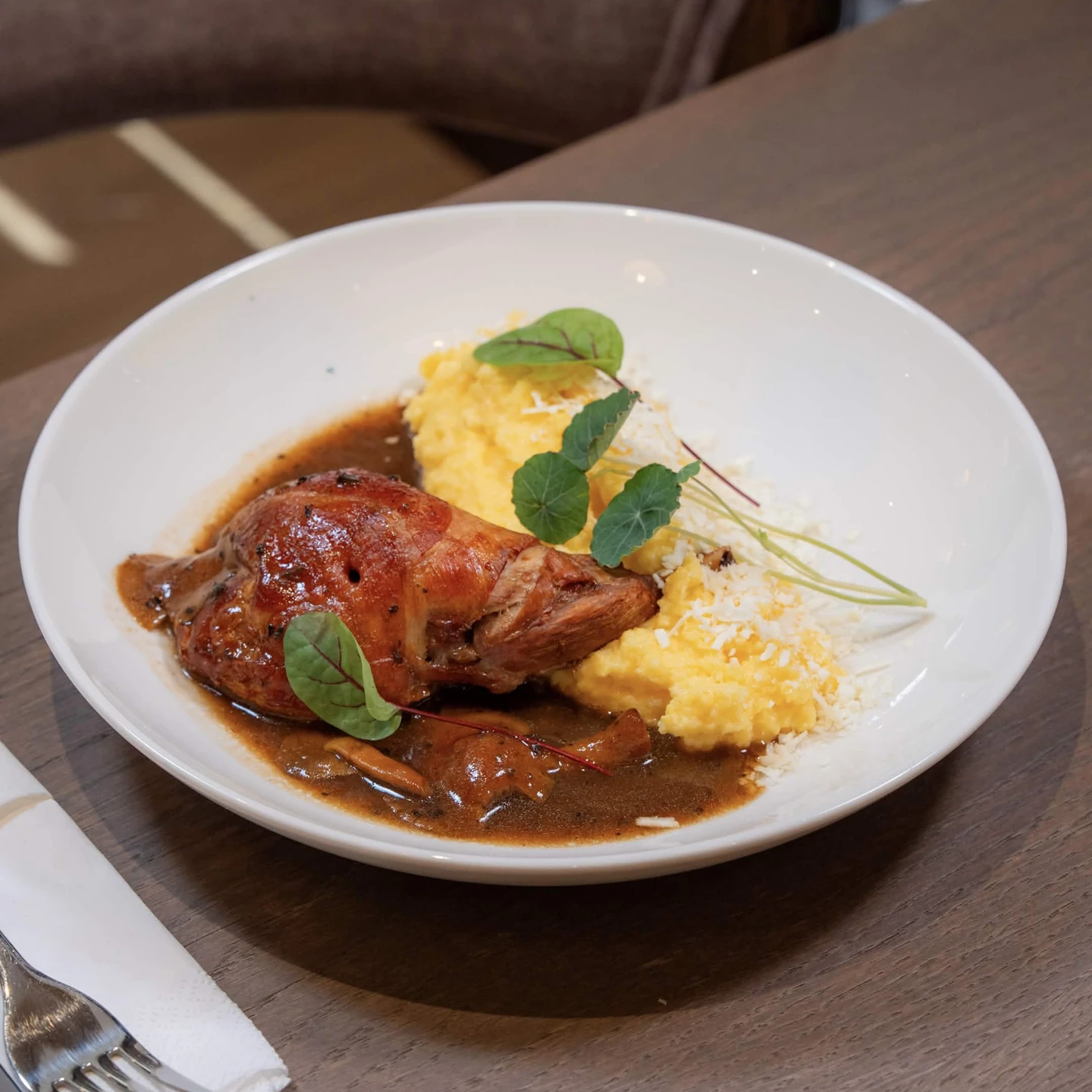 Rabbit Leg with Creamy Polenta and Mushroom Sauce